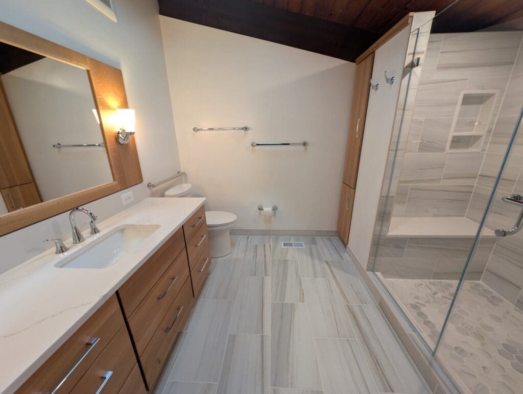 Beyond the basic vanity setup, countertops can serve both functional and aesthetic purposes in unique and unexpected ways throughout the bathroom.